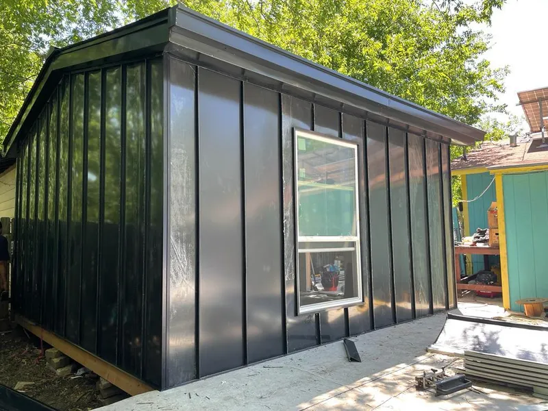 Black standing seam metal wall panels for Roof Inspection in Hyde Park